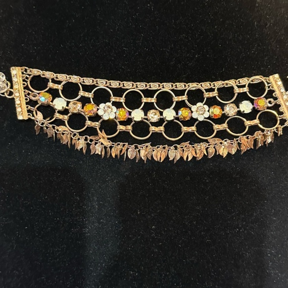 Toggle gold tone and crystal 5 stand bracelet. Hardrock casino.